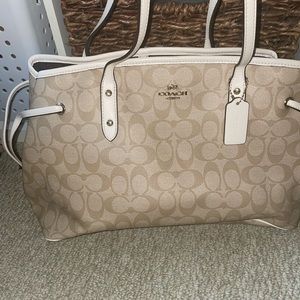 White and tan tote leather coach bag with matching white wallet